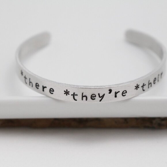 *There *They're *Their - Hand Stamped Anodized Aluminum Bangle - Adjustable - Picture 9 of 14